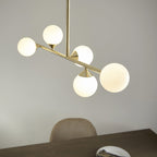 Modern Linear 5 Light Ceiling Pendant Light In Satin Brass With White Glass Shades