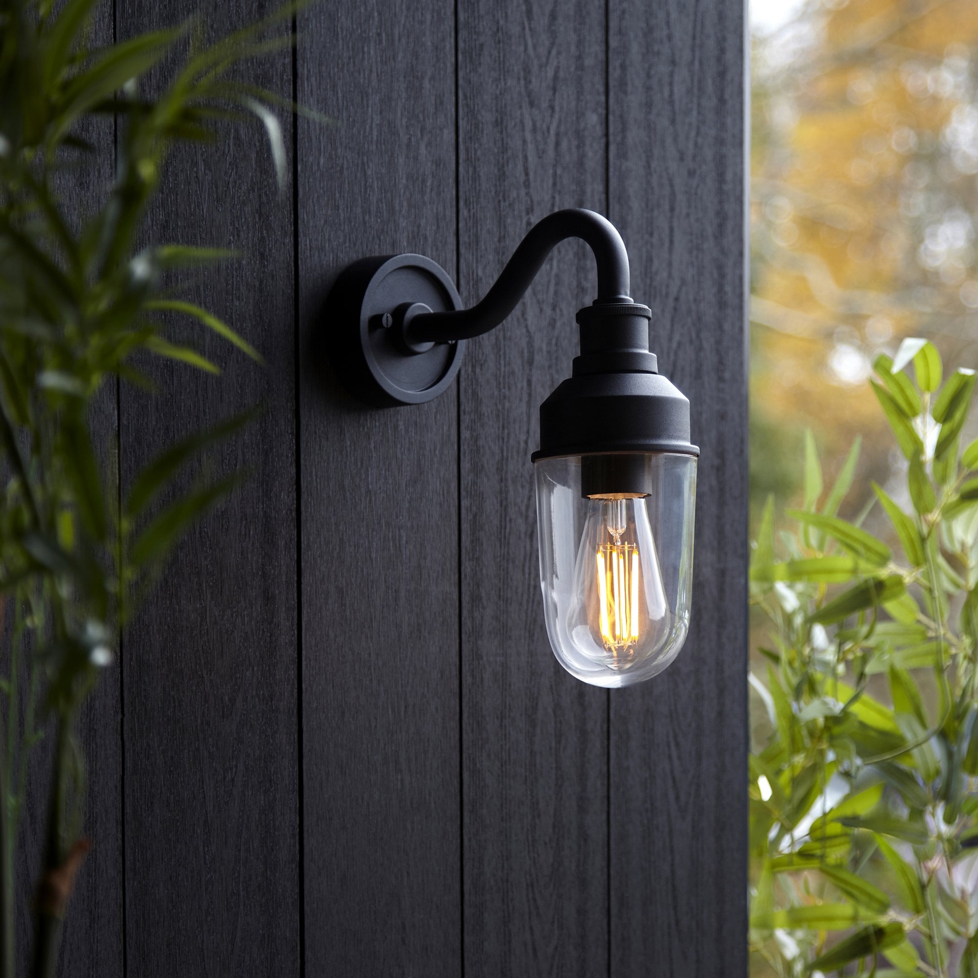 Classic Curved Arm Exterior Wall Light In Matt Black Finish With Clear Glass Shade IP44