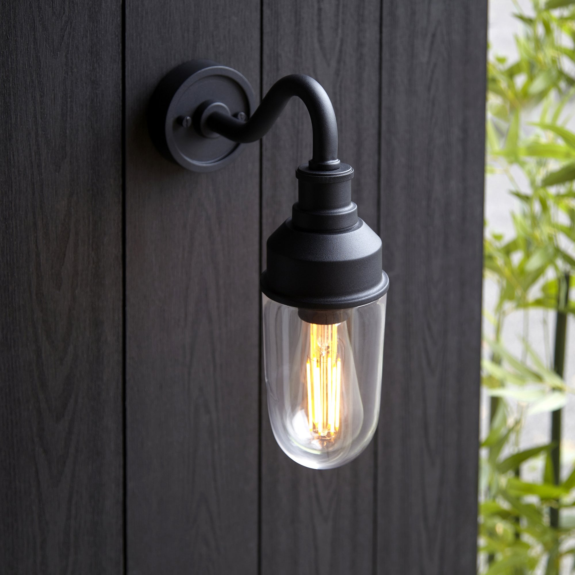 Classic Curved Arm Exterior Wall Light In Matt Black Finish With Clear Glass Shade IP44