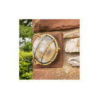 Jetty Small Coastal Round Wall Lantern In Raw Brass Finish
