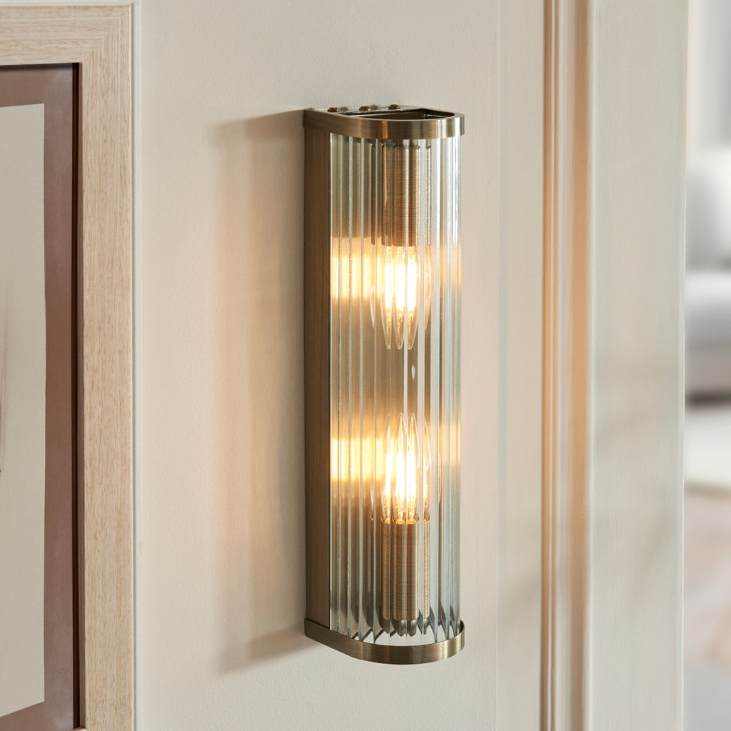 Ridgeton Twin Wall Light In Antique Brass With Ribbed Glass 118597
