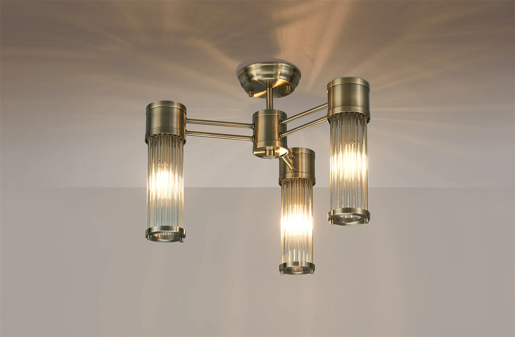 Pillar 3 Light Bathroom Semi Flush Ceiling Light In Antique Brass And Clear Glass Rods IP44 E14